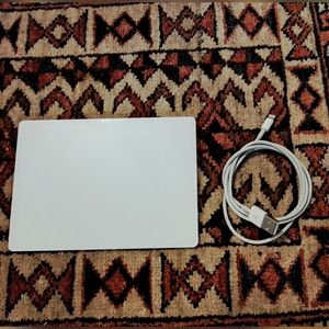 Apple Magic Trackpad with cable.